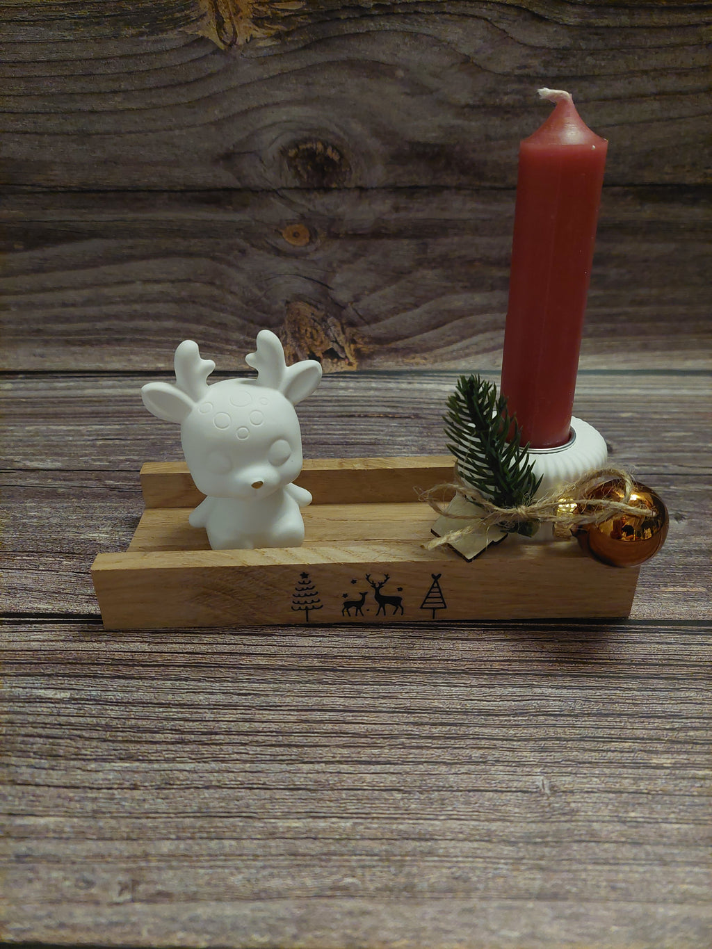 Stabkerze mit kleiner Figur